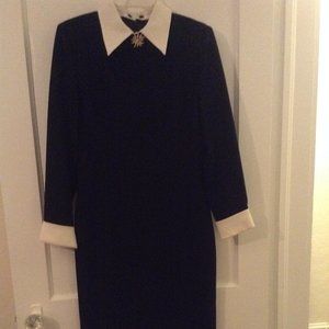 White cuff dress with gold rhinestone brooch